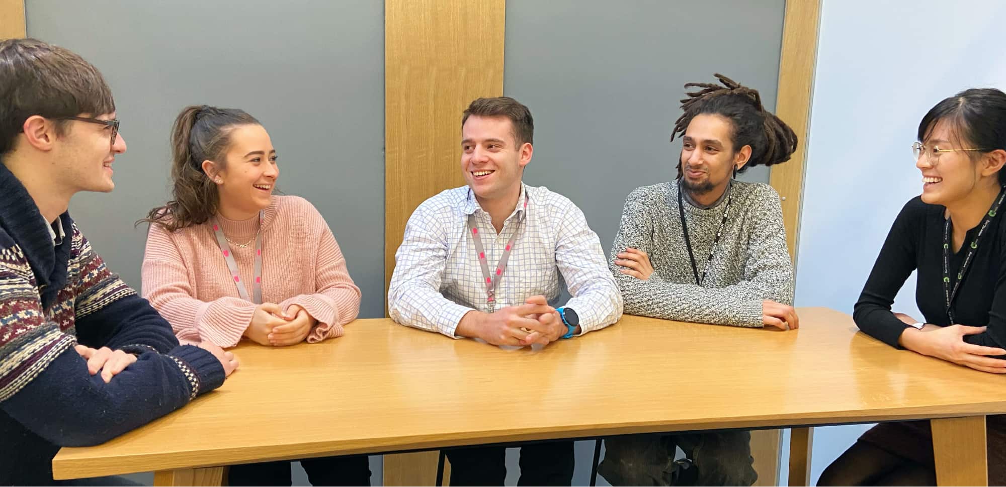 Group of people sat round a table 